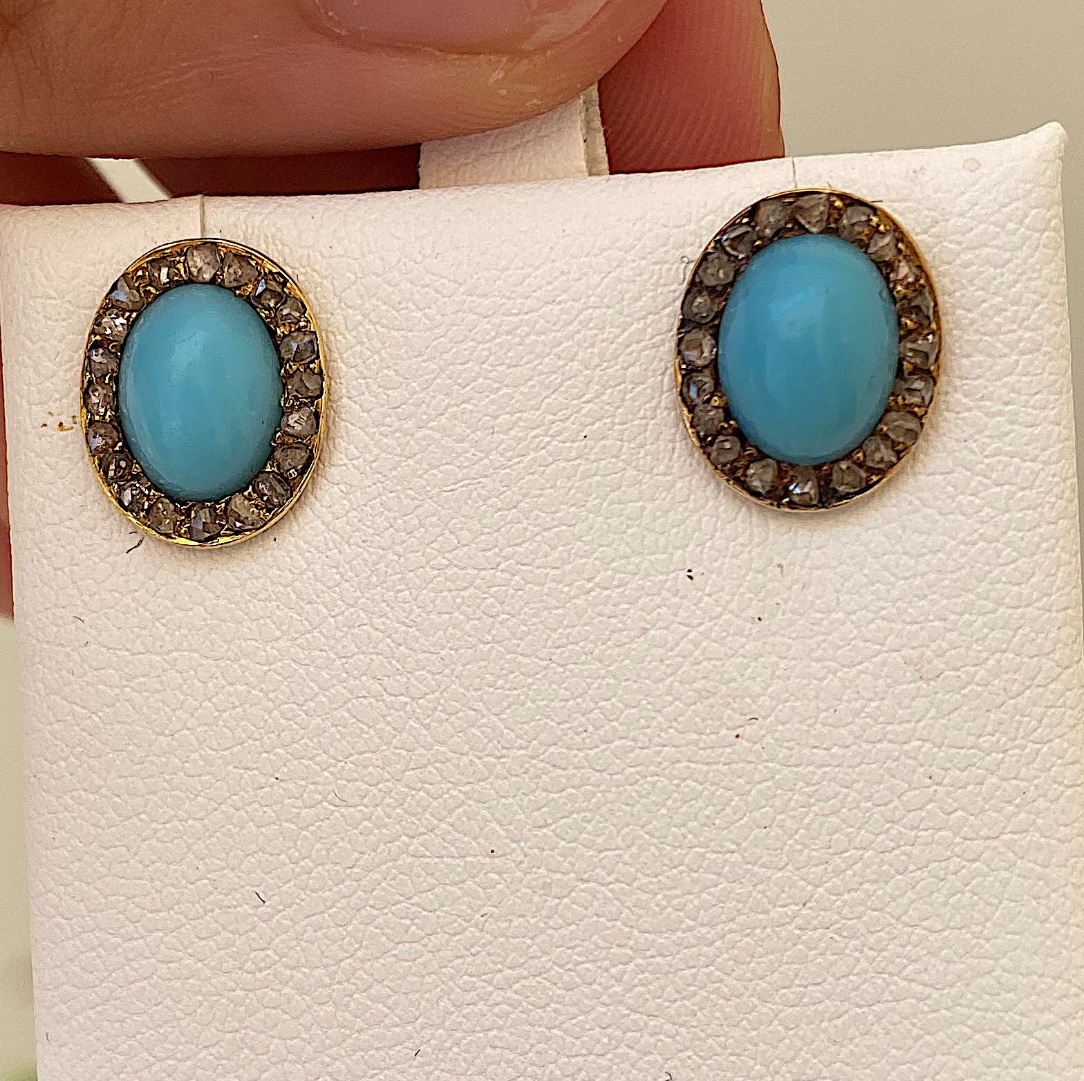 עגילים עתיקים עם טורקיז אובלי ויהלומים .